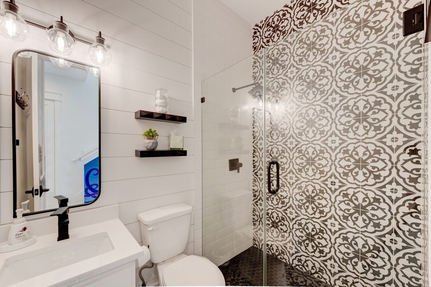1st floor bathroom with patterned tile shower