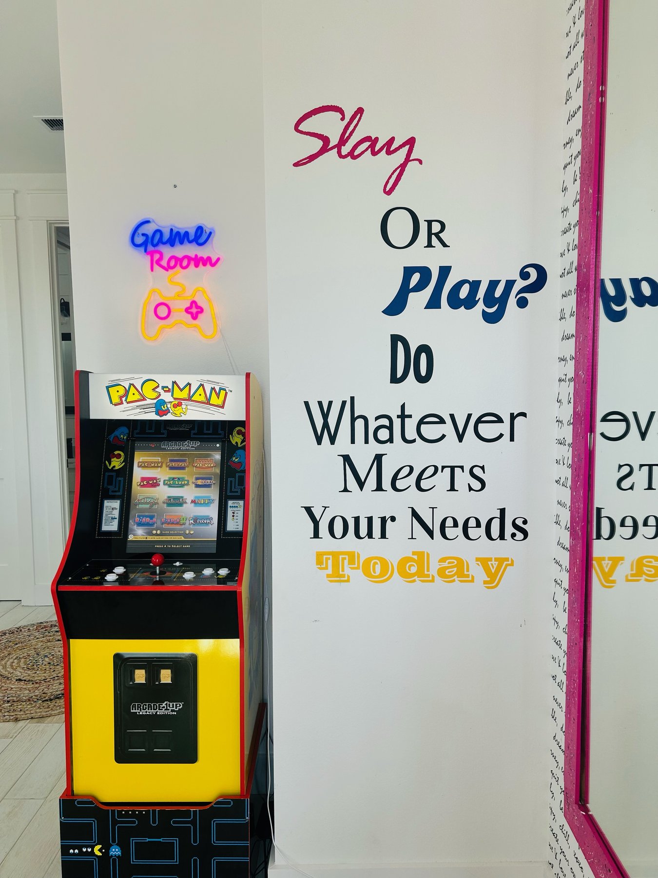 Slay or Play Loft — Pac-Man arcade and neon Game Room sign