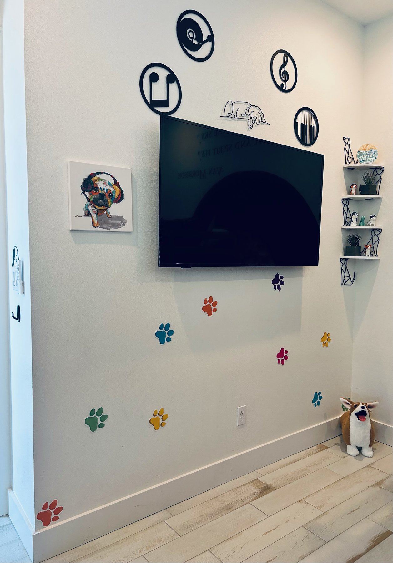 Music room TV wall with notes and paw prints