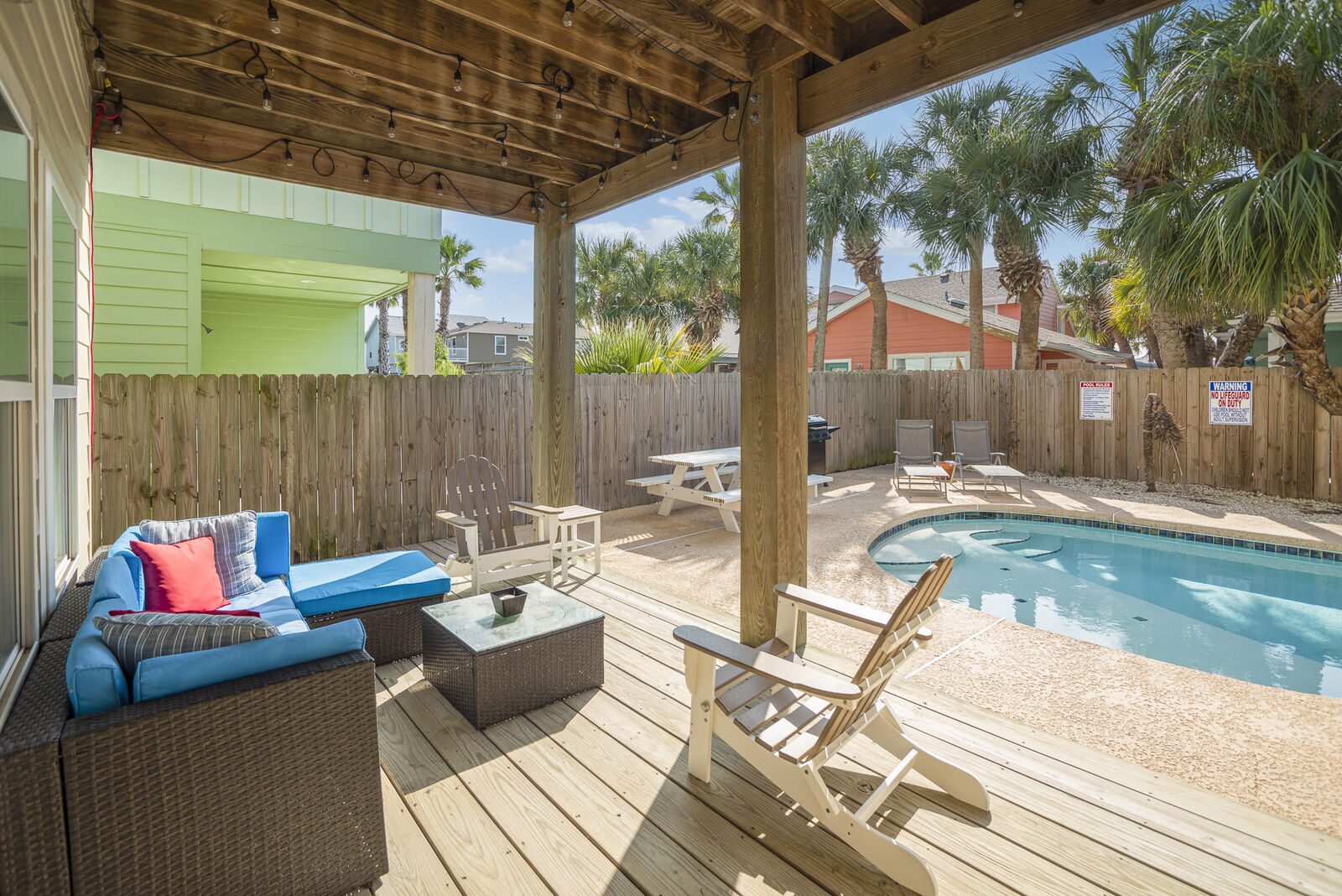 Covered outdoor living area by the pool