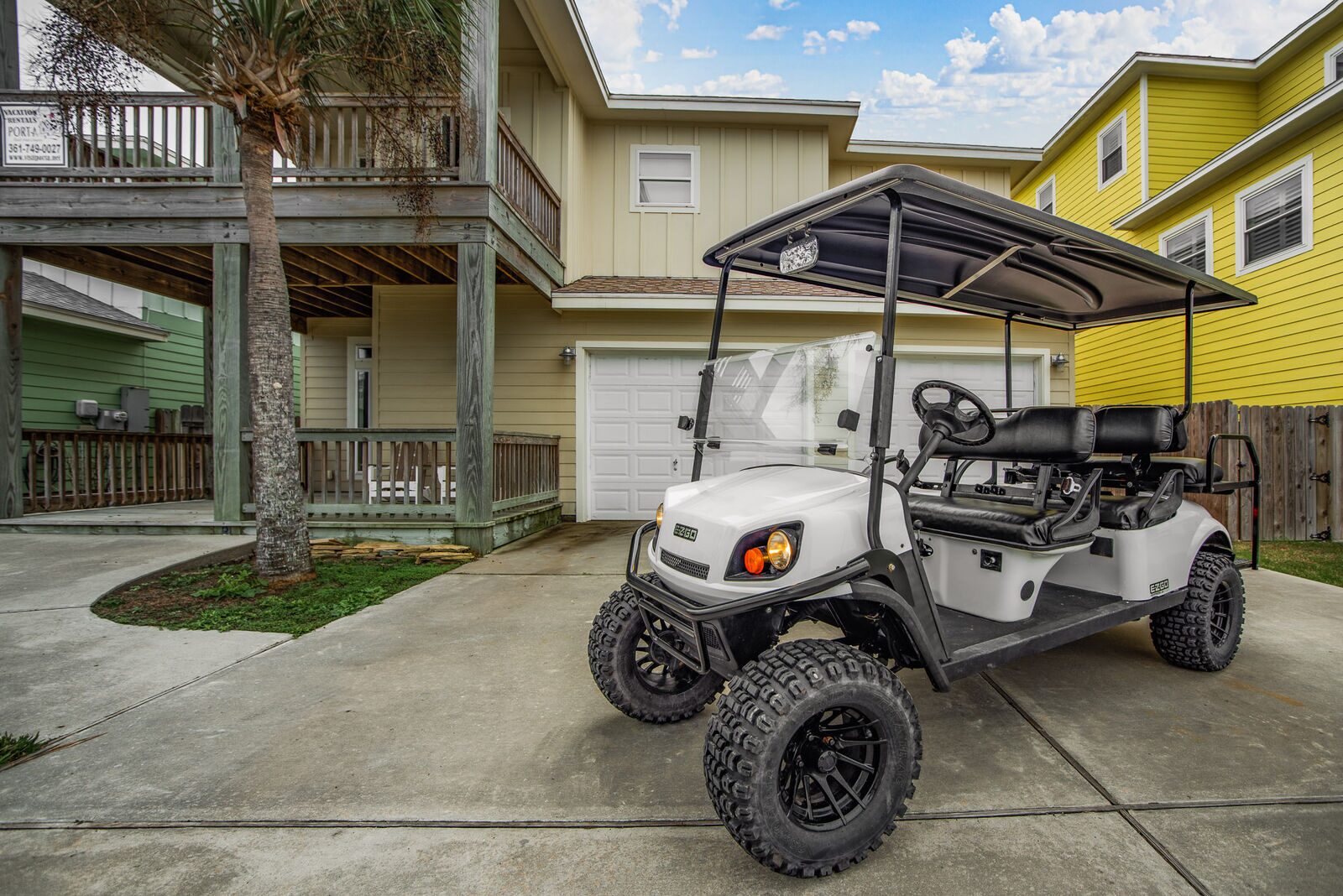 Front exterior with 6-seater golf cart