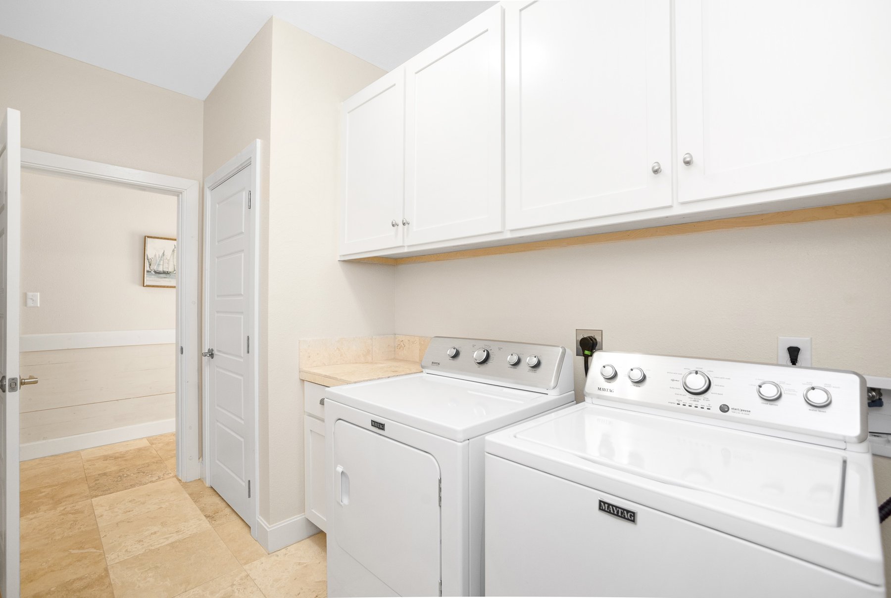 Laundry room with full-size washer and dryer
