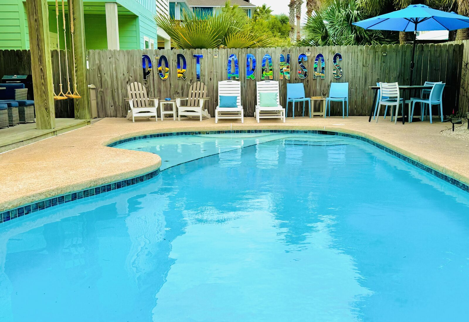 Pool with Port Aransas sign