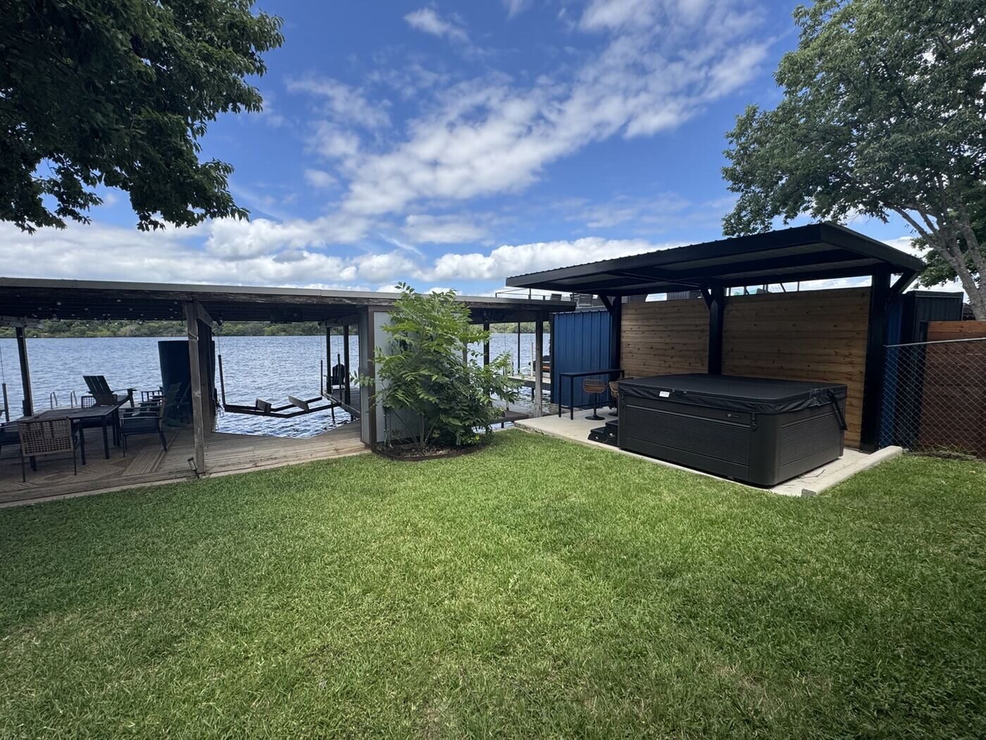 Spa and patio cover overlooking the lake
